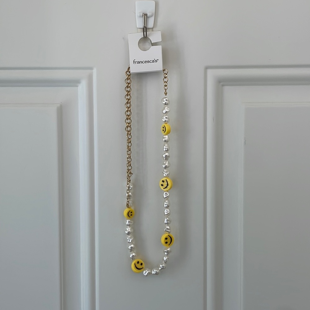 Francesca’s smiley face necklace
